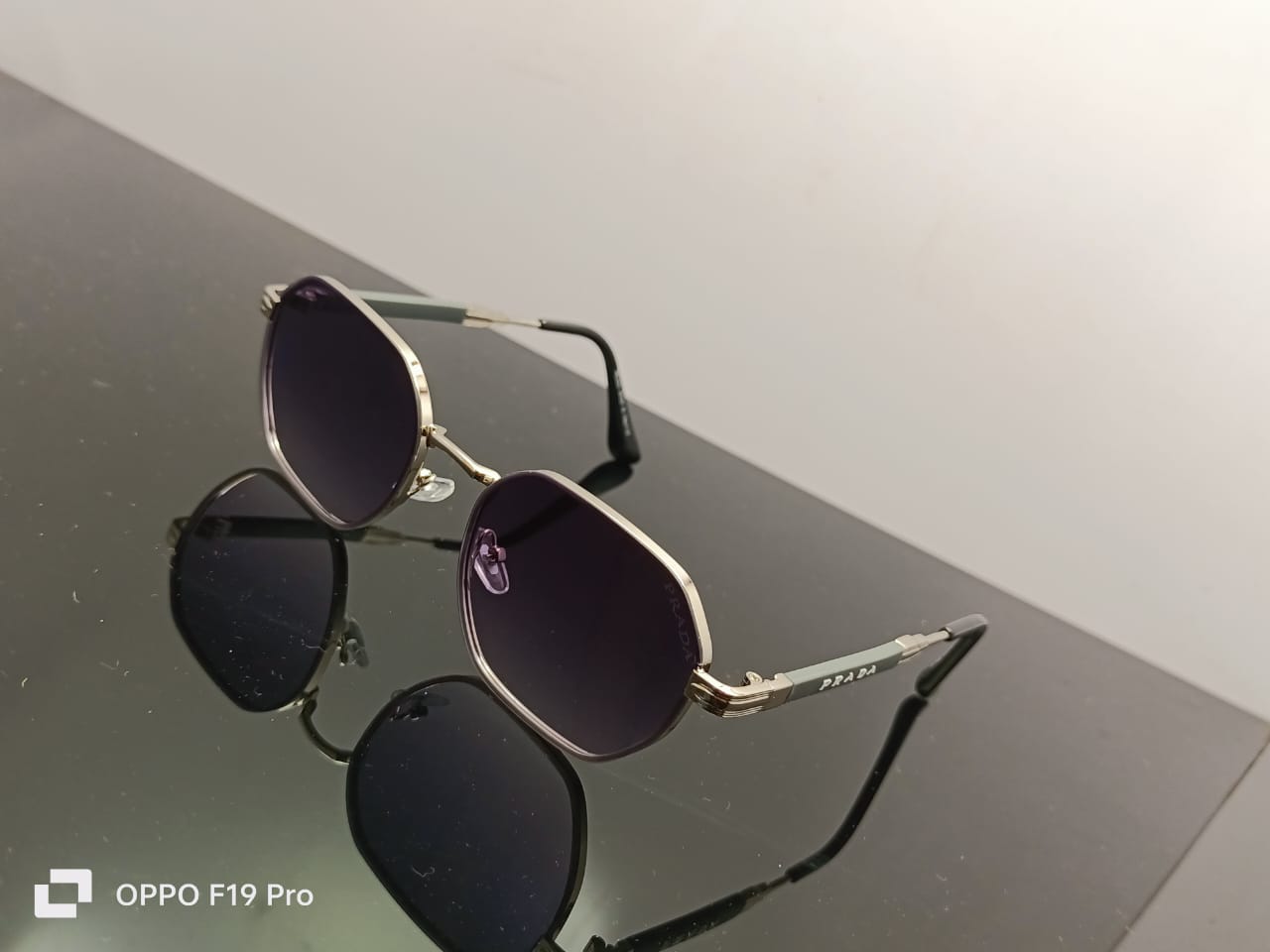 Prada Luxe Iconic Sunglasses Silver Frame | Gradient Black Lenses | Grey Temple Arms